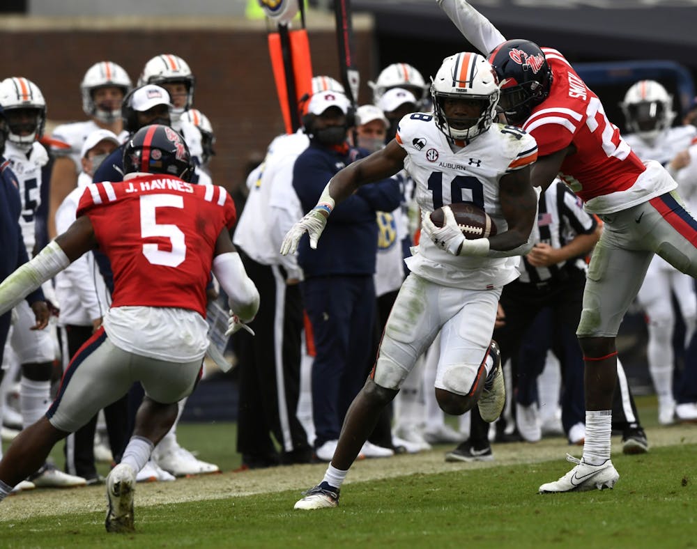 <p>Seth Williams (18) runs the ball for touchdown during the game between Auburn and Ole Miss at Vaught Hemingway Stadium in Oct 3, 2020; Oxford, MS, USA.&nbsp;</p>
