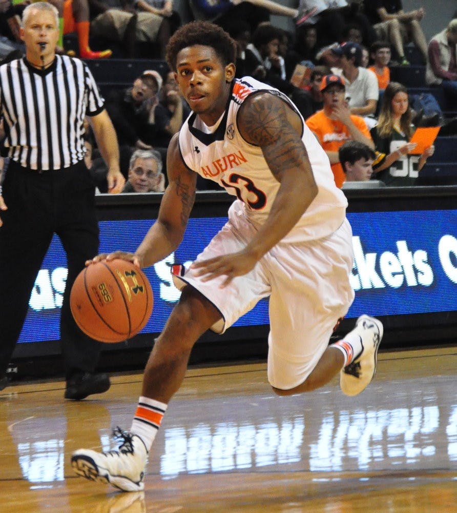 Freshman point-guard Tahj Shamsid-Deen runs the ball up the court Monday night. Anna Grafton / PHOTO EDITOR