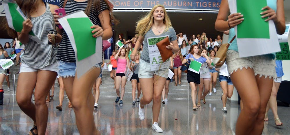 <p>New sorority members rush out of the Auburn Arena to find their new sisters. 2015 Bid Day on Friday, August 14.</p>