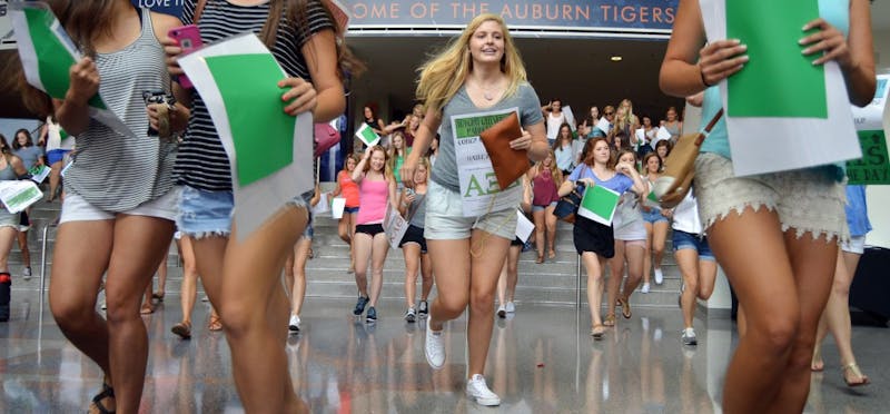 New sorority members rush out of the Auburn Arena to find their new sisters. 2015 Bid Day on Friday, August 14.