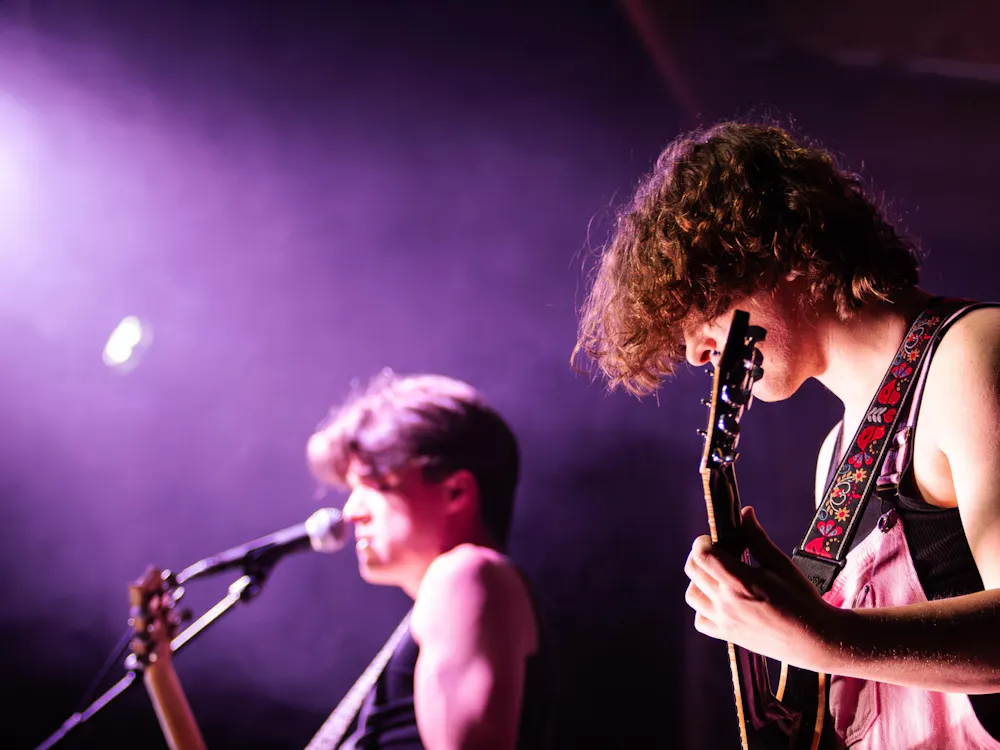 Wilson Gore (left) and Curry Jones (right) from The Band Honey perform in front of the audience at AubFest on Friday, March 20, 2026 in Auburn, Ala.