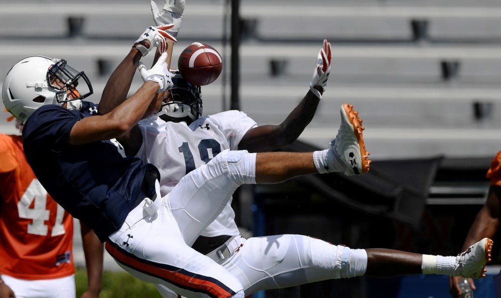 Defender Jayvaughn Myers takes the ball and makes the interception from receiver Anthony Schwartz during scrimmage Thursday.Auburn football scrimmage on Thursday, Aug. 9, 2018 in Auburn, Ala.Todd Van Emst/AU Athletics 