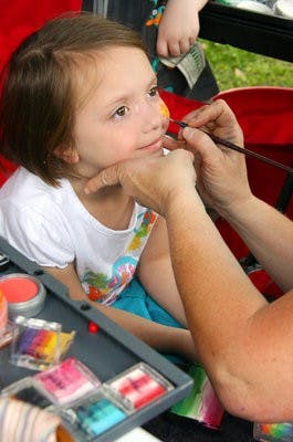 Ansley, 4, from the Opelika area, gets a ladybug painted on her face at the Garden in the Park Festival. (Rebekah Weaver/ASSISTANT PHOTO EDITOR)