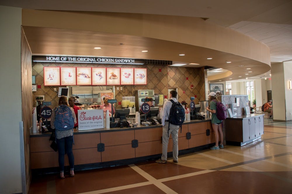 <p>Students wait for their food at the on-campus Chick-fil-A on Wednesday, 11, 2018, in Auburn, Ala.</p>