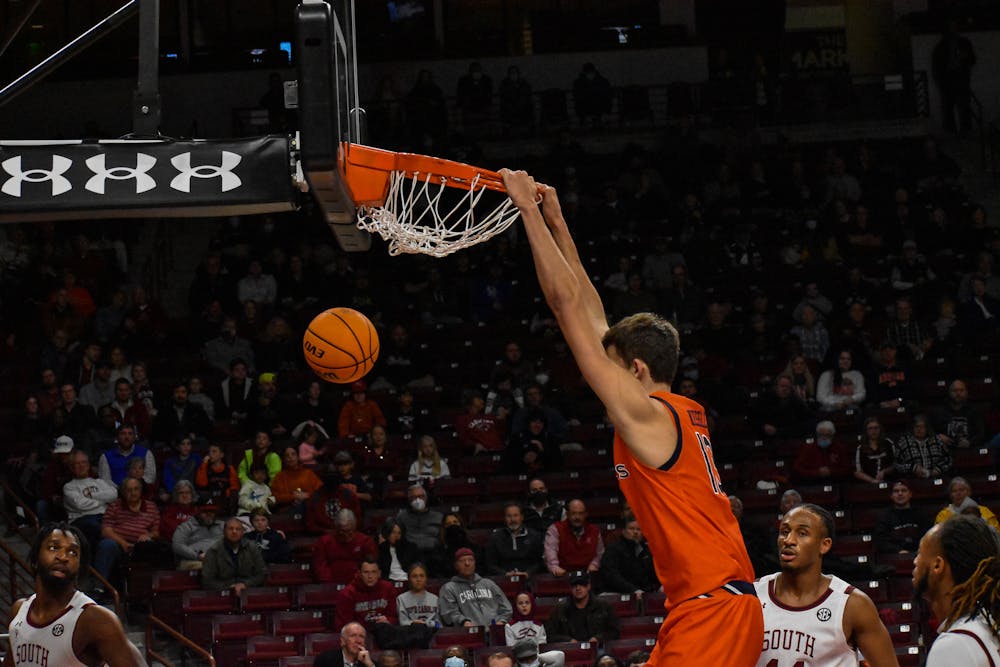 January 4, 2022; Columbia, South Carolina; Walker Kessler (13) slams down a dunk in a match between Auburn and South Carolina  in Colonial Life Arena.