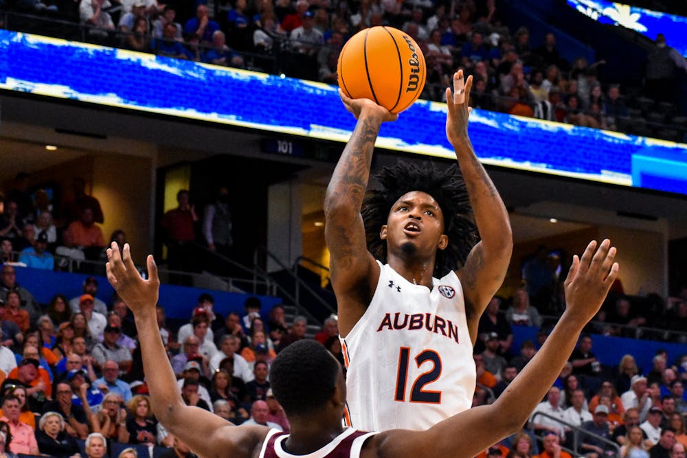 Zep Jasper (12) posts up for a floater during a match between Auburn and Texas A&M in the SEC Tournament in Tampa, Florida, on March. 11, 2022.