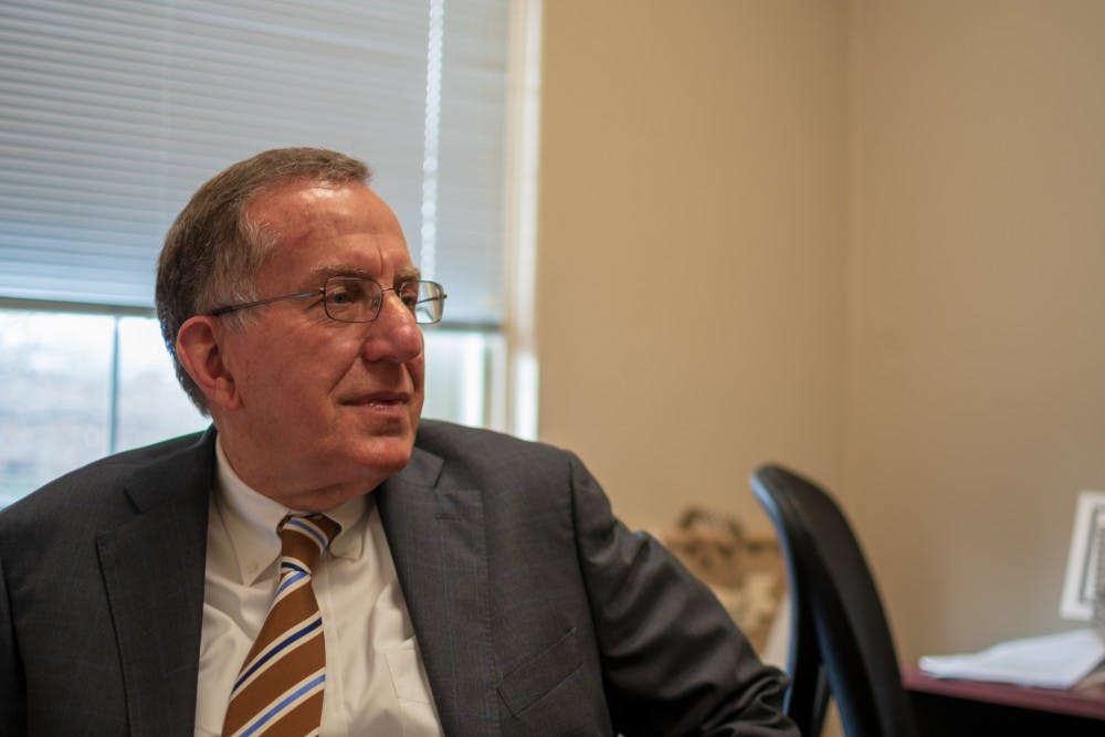 Professor Philip Rawls sits in his office, on Monday, Feb. 18, 2019, in Auburn, Ala.