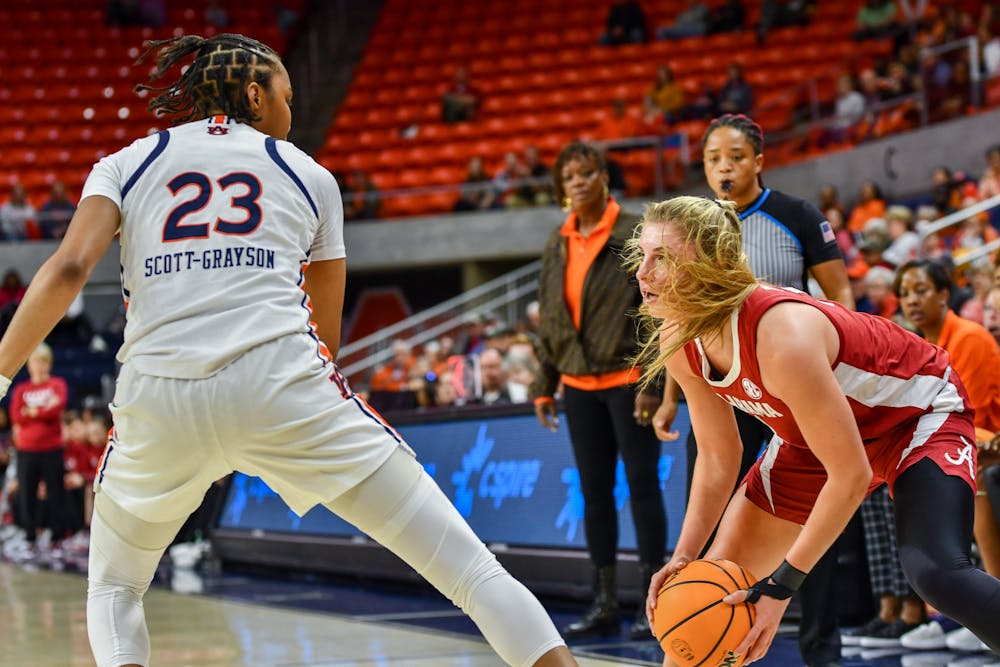 Scott Grayson (#23) covering Alabama player in a match of Auburn and Alabama at Neville Arena on January 8th 2023