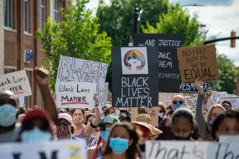 A crowd marches at the Auburn Protest against Police Brutality, on Sunday, June. 7, 2020, in Auburn, Ala.