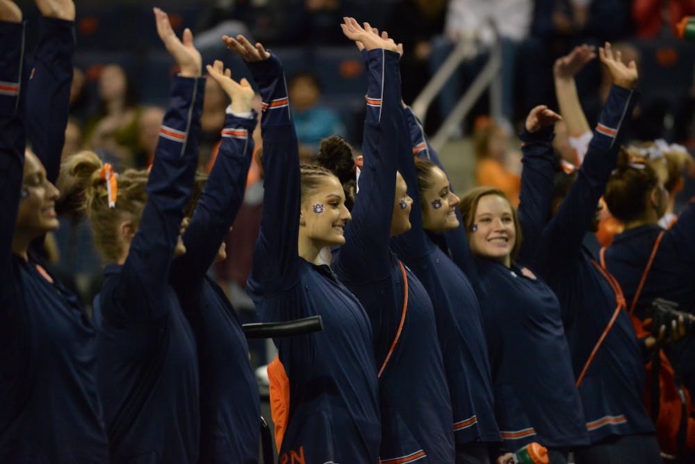 <p>Auburn gymnasts turns to the crowd during Auburn gymnastics vs. Missouri.</p>
