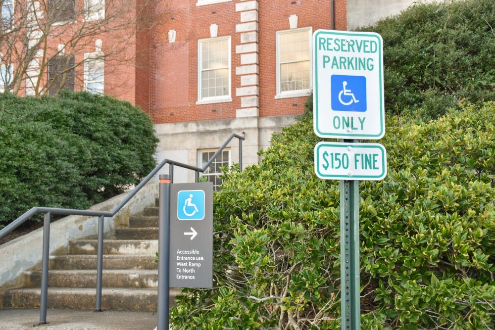 <p>Accessibility signs outside of Tichenor Hall on Thursday, Jan. 11, 2018, in Auburn, Ala.</p>