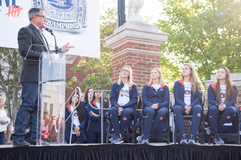 <p>Greg Williams, head equestrian coach, points at senior members of his team at the&nbsp;celebration of Auburn's fifth equestrian national championship in Auburn, Ala. on Tuesday, April 24, 2018.</p>