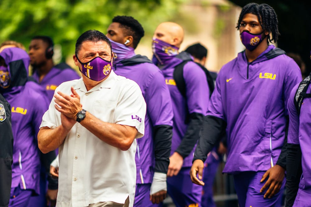 <p>LSU football head coach Ed Orgeron walks down Victory Hill with his team Saturday, April 17, 2021 where the LSU football white team defeated purple 23-14 during their spring game at Tiger Stadium in Baton Rouge, La. Credit: Abby Kibler / The Reveille</p>