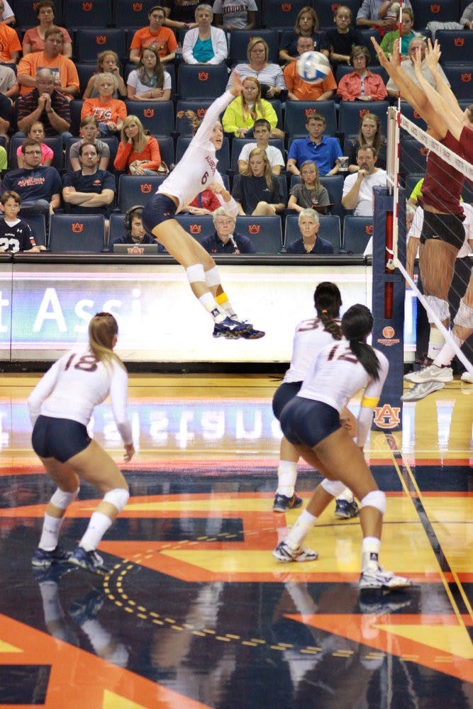 Katherine Culwell spikes the ball across the net. (Jenna Burgess / Associate Photo Editor)