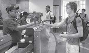 Jonathan Howald, junior in wireless engineering, uses his tigercard at Chick-fil-A in the Student Center. (Danielle Lowe / PHOTO EDITOR)