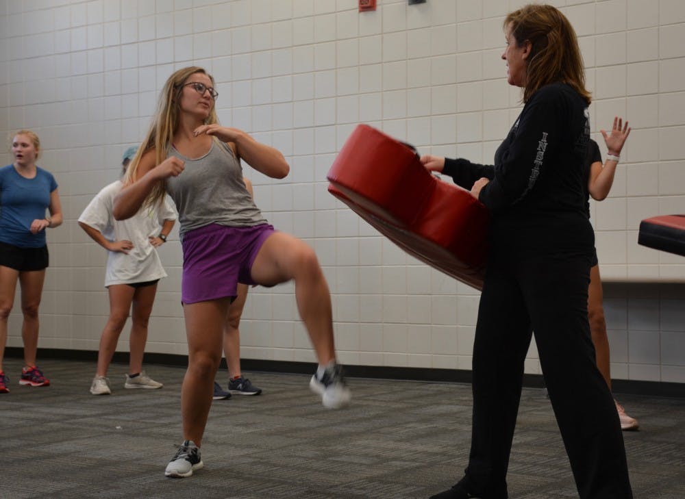 Self-defense participant executes a kick, Oct. 9, 2018.