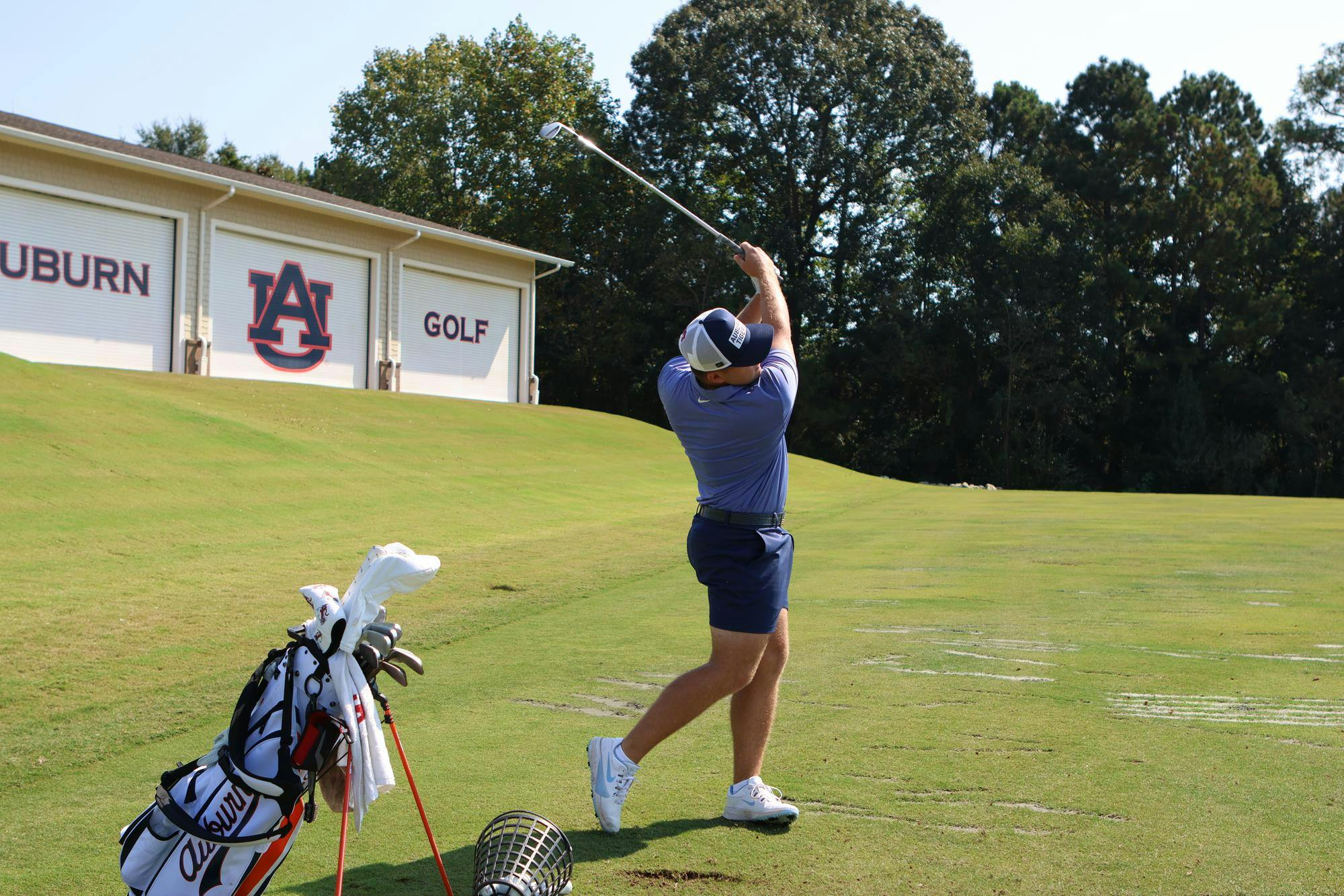 Josiah Gilbert at practice on the driving range.