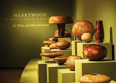 There are multiple wood art pieces on display along with the Toomer's Oaks bowl.