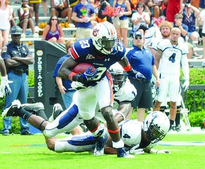 Onterio McCalebb breaks away from a Utah State defender during the Tigers' 2011 season opener.