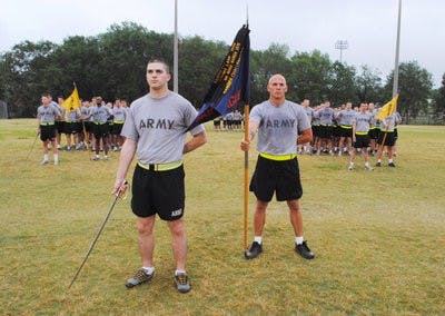 Carson Filipowski, senior in art, and James Reed, junior in public administration, stand in formation. (Maria Iampietro / ASSISTANT PHOTO EDITOR)