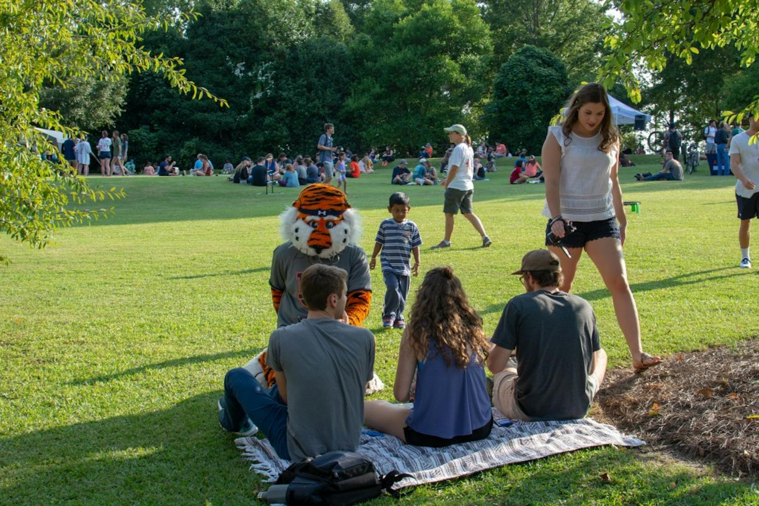 Members of the public spend some time with Aubie during the Sustainability Picnic at Donald E. Davis Arboretum, on Wednesday, Aug. 22, 2018, in Auburn, Ala.