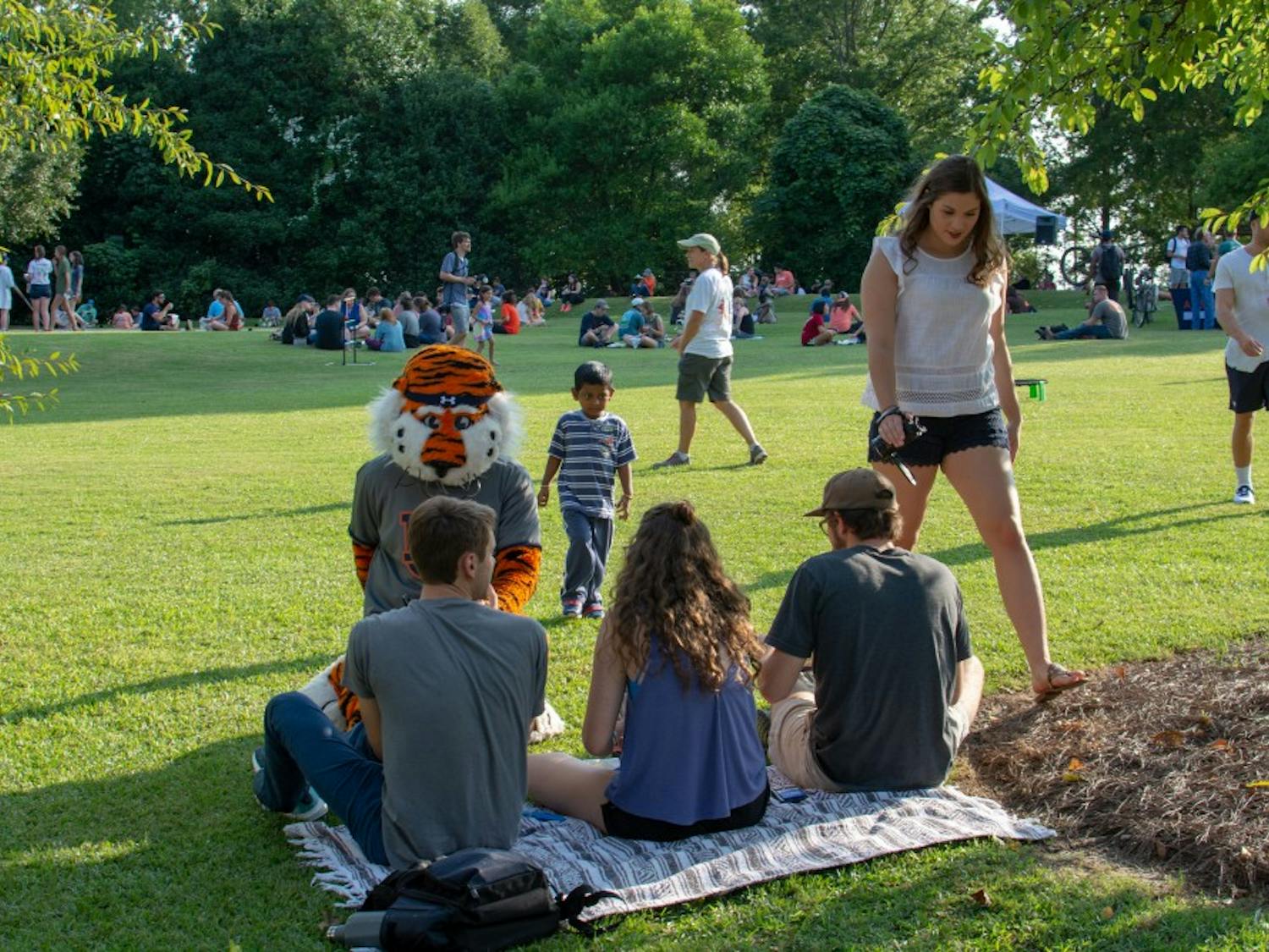 Members of the public spend some time with Aubie during the Sustainability Picnic at Donald E. Davis Arboretum, on Wednesday, Aug. 22, 2018, in Auburn, Ala.