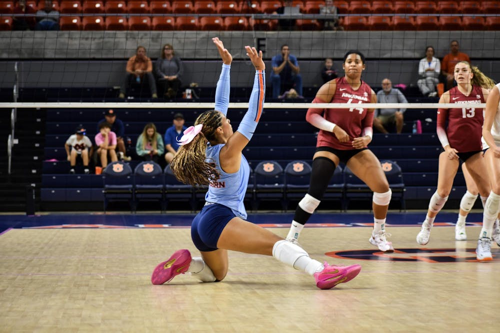 Senior Alexis Dacosta makes a last-minute save getting the ball over the net at the Auburn Volleyball game on Wednesday, Oct. 22, 2025, in Auburn Alabama. 