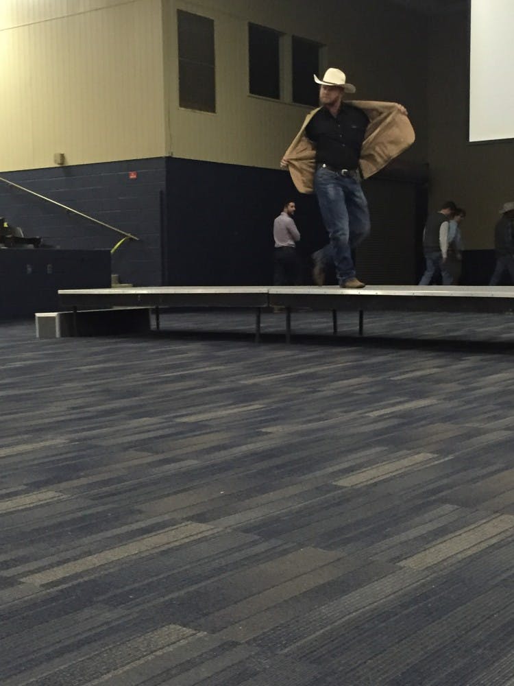 Noel Welch, senior in agronomy and soils production,&nbsp;walks across the stage.&nbsp;