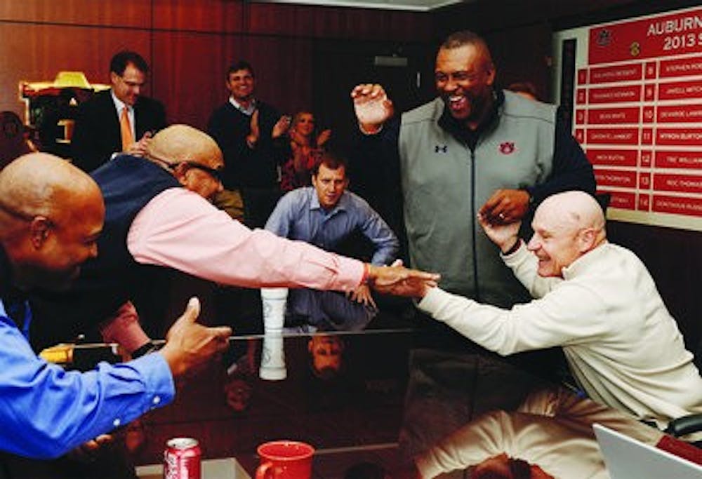 Charlie Harbinson, Melvin Smith, Rodney Garner, and J.B. Grimes celebrate Braden Smith signing with Auburn on National Signing Day on Wednesday, Feb. 5, 2014. (Contributed by Lauren Bernard)