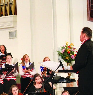 Choir gathers for annual Star Spangled Spectacular event. (Alex Sager / PHOTO EDITOR)