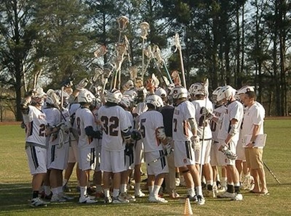 The Auburn lacrosse team rallies before its match against Kennesaw State. The Tigers defeated Kennesaw State 13-6 in the season opener Feb. 2, 2013. (Courtesy of Carie Cato)