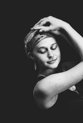 Kayla Perry poses wearing a chain with a bone marrow tag, which she has to wear for a year after her transplant. (Contributed by Christen Perry)