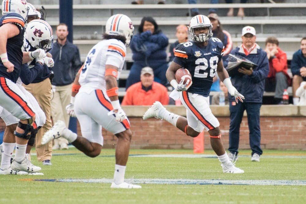 JaTarvious Whitlow (28) runs downfield&nbsp;during Auburn's A-Day game on Saturday, April 7, 2018, in Auburn, Ala.