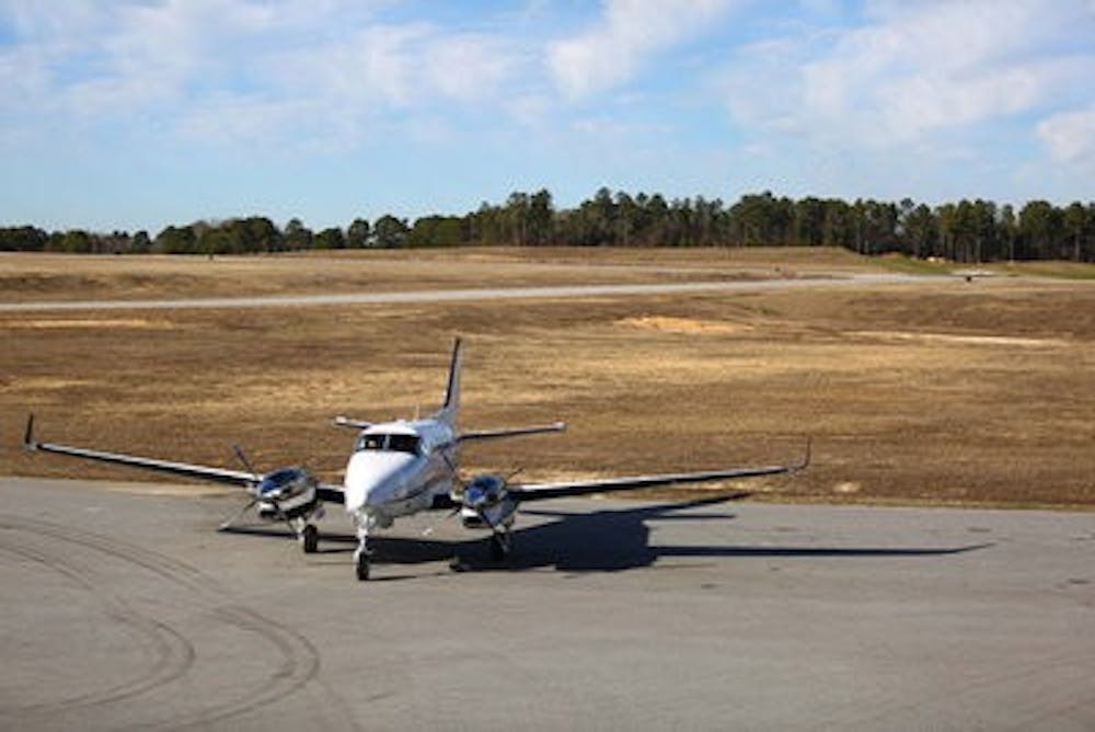 A Beechcraft King Air sits at the Auburn University Regional Airport which is paying $225,000 to remove trees. (Kenny Moss | Assistant Photo Editor)