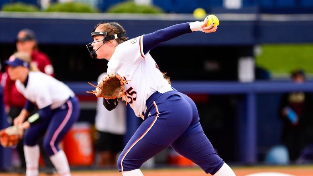<p>Shelby Lowe (55) throws a pitch against ULM on Feb. 25 at Jane B. Moore Field in Auburn, Alabama.&nbsp;</p>