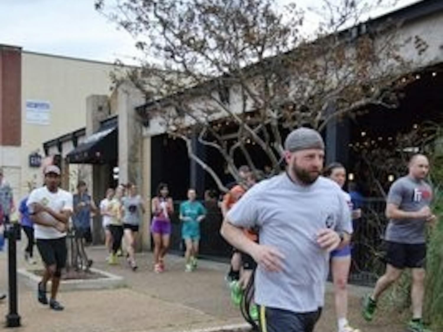 Runners met at Quixote's and celebrated with a couple of beers. (Raye May / PHOTO EDITOR)