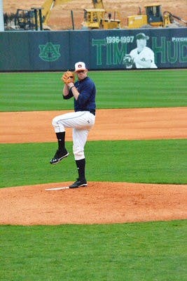 Senior pitcher Derek Varnadore winds up during Friday's practice. (Danielle Lowe / ASSISTANT PHOTO EDITOR)