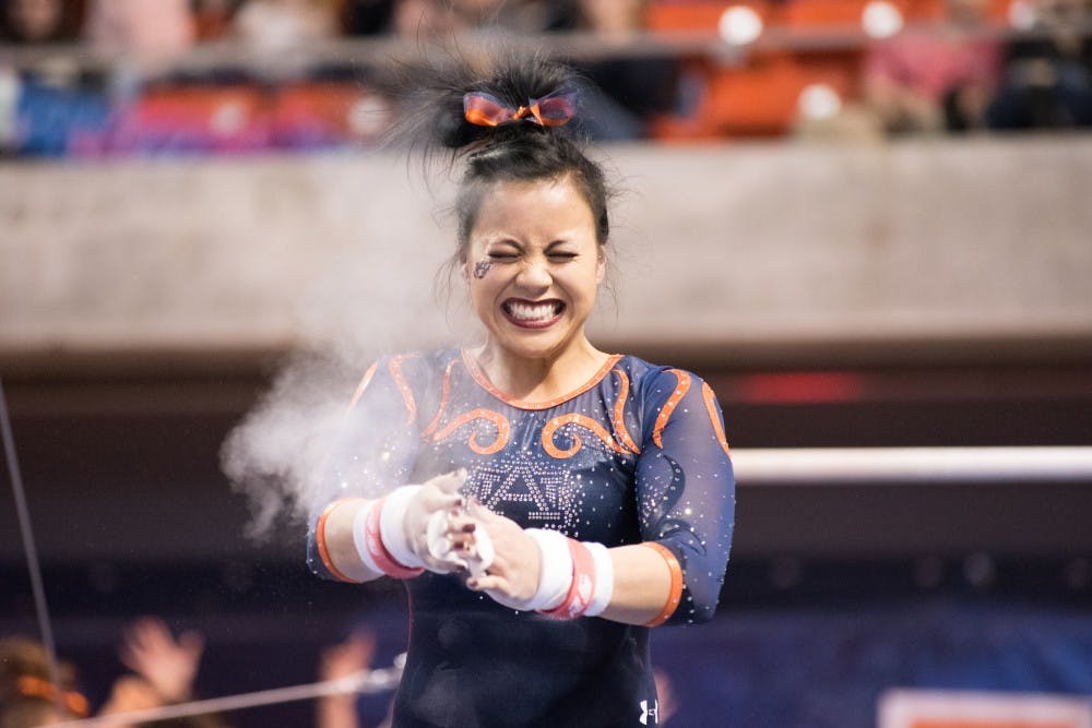 Samantha Cerio reacts after her uneven bars routine&nbsp;at Auburn Gymnastics vs. Kentucky at Auburn Arena in Auburn, Ala. on Friday, Jan. 26, 2018.