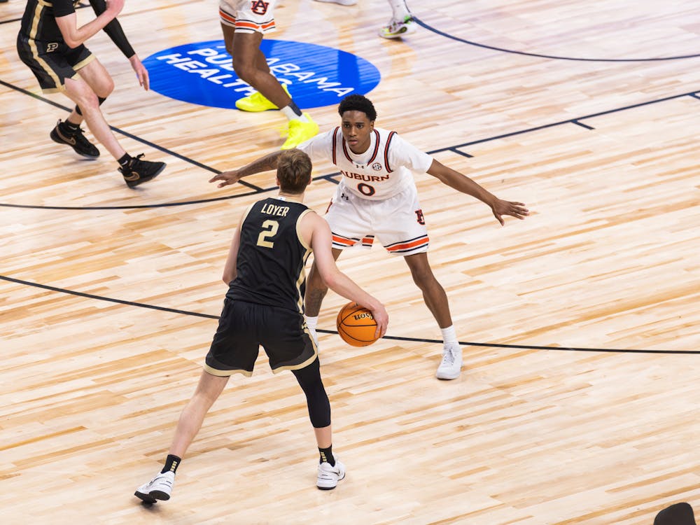 Tahaad Pettiford matched up with Fletcher Loyer during the second half of Auburn vs Purdue on Dec. 21, 2024. 