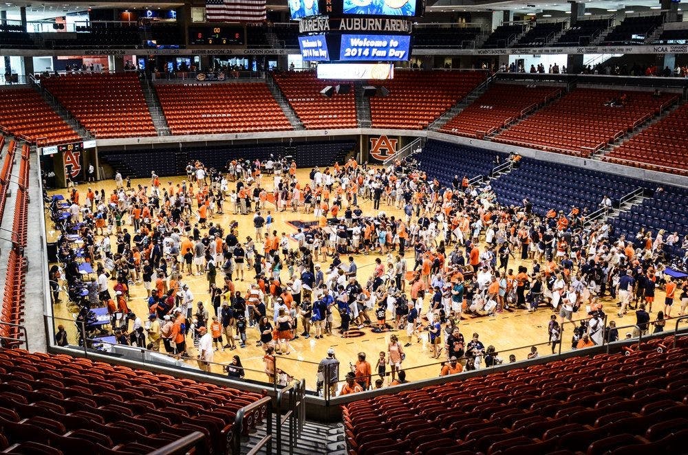 Auburn fans lined up all over the arena to meet players and coaches at Auburn Fan Day Sunday, Aug. 10, 2014. Raye May | PHOTO &amp; DESIGN EDITOR