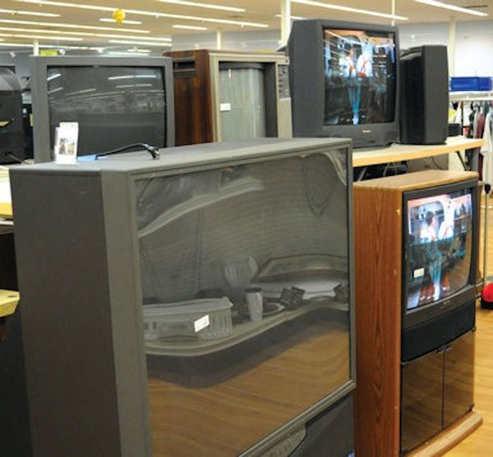 Rows of televisions, recliners and tables line the walls of the Harvest Thrift Super Center. (Chelsea Harvey / CAMPUS EDITOR)