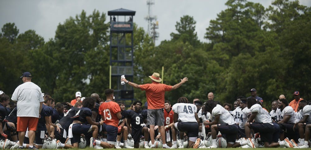 Auburn coach Gus Malzahn talks to his team after practice Saturday.Auburn football practice on Saturday, Aug. 18, 2018 in Auburn, Ala.Todd Van Emst/AU Athletics 