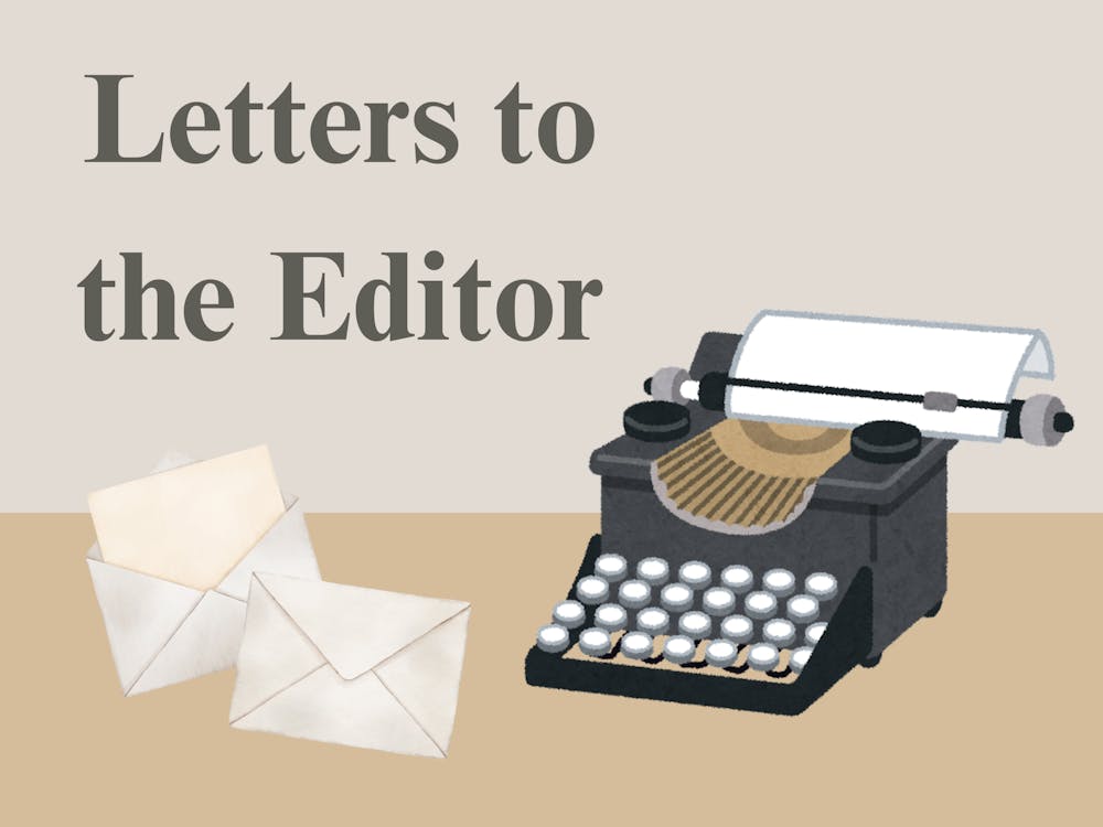 Typewriter with paper and envelopes, with side text reading, "Letters to the Editor."