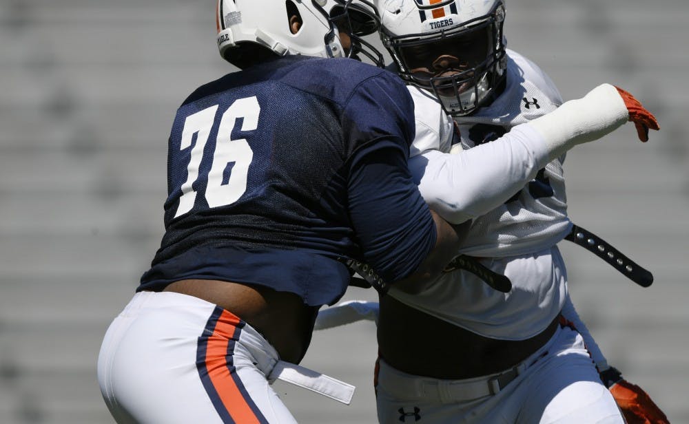 Prince Tega Wanogho and Nick CoeAuburn football practice, first day in pads, on Saturday, March 23, 2019 in Auburn, Ala. Todd Van Emst/AU Athletics