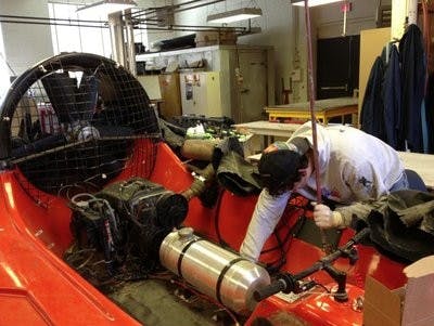 Garrett Blackburn works on hovercraft to prepare for competition. (Derek Herscovici / WRITER)