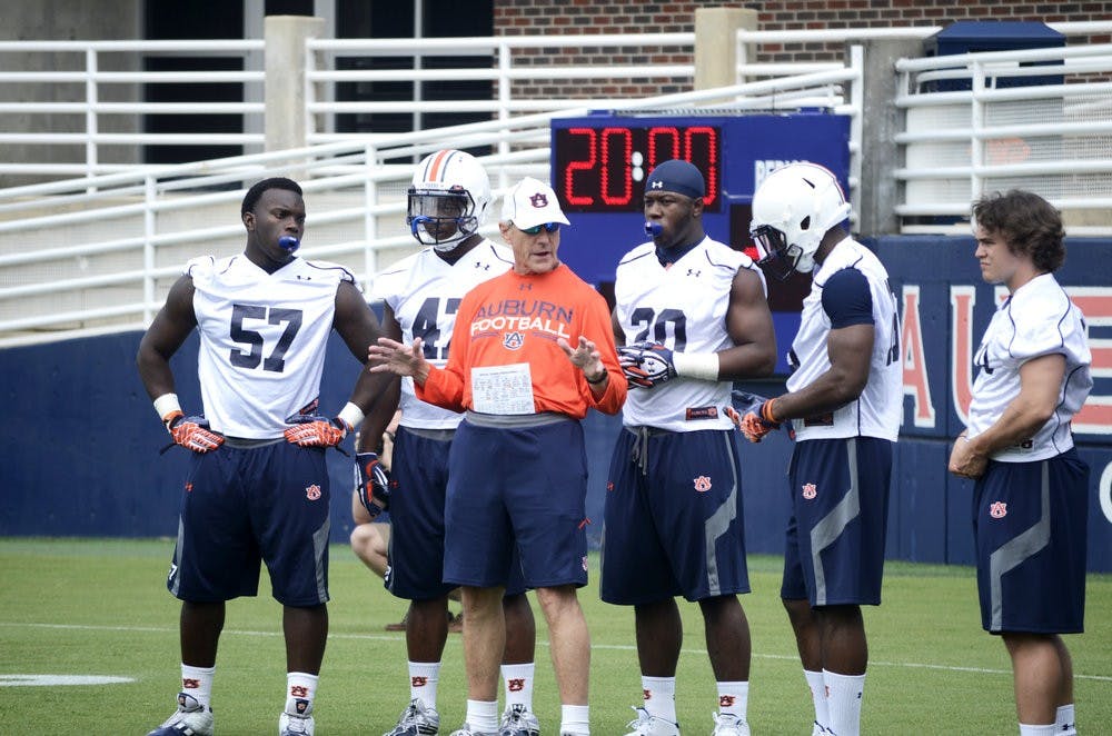 Defensive Coordinator, Ellis Johnson, coaching his players at Fall practice day one. Sarah May/ ASSISTANT PHOTO EDITOR