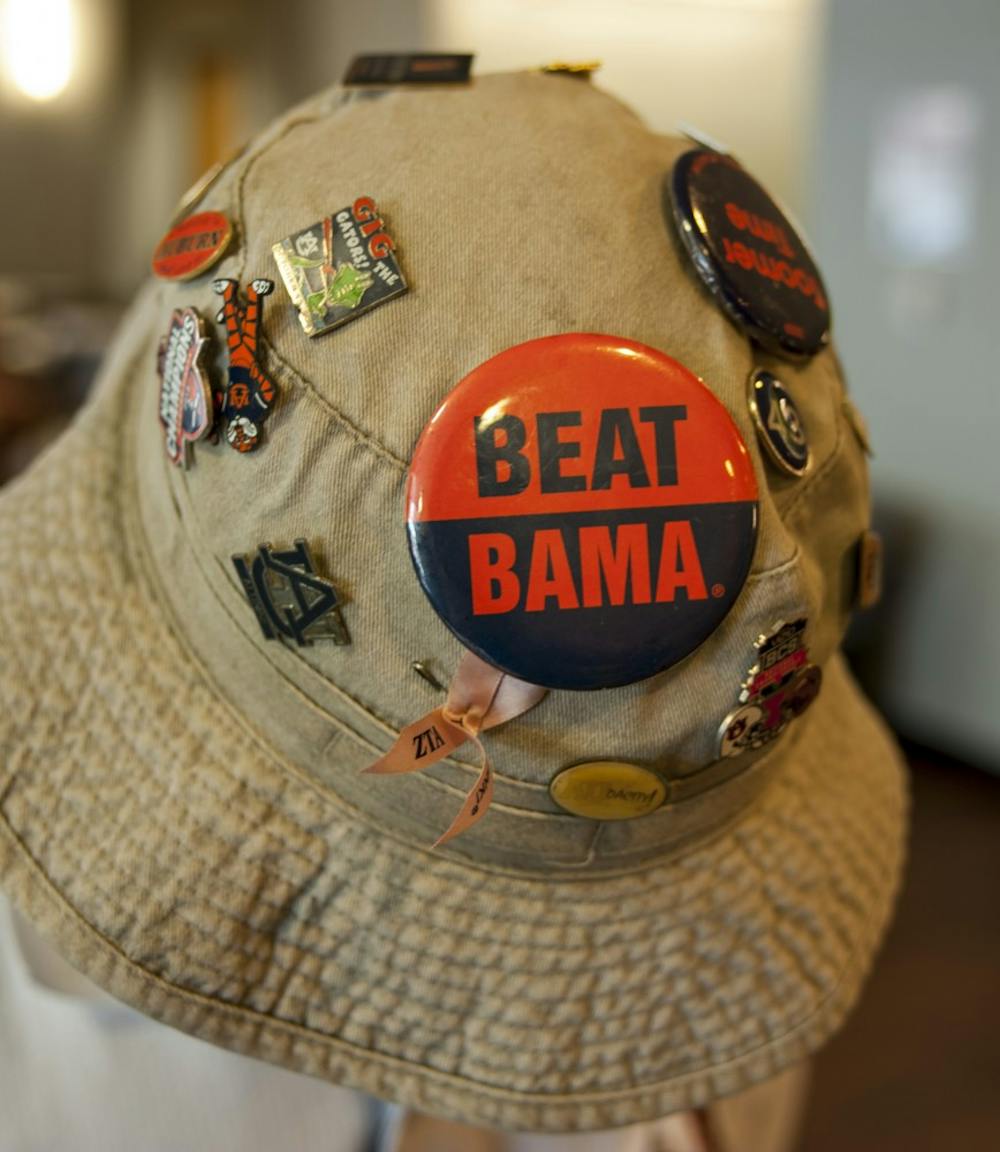 <p>Auburn fan Joe Hurd shows off his collection of Auburn pins and buttons on his gameday hat in the Student Center. Auburn vs Georgia State on Saturday, Sep. 2 in Auburn, Ala.</p>