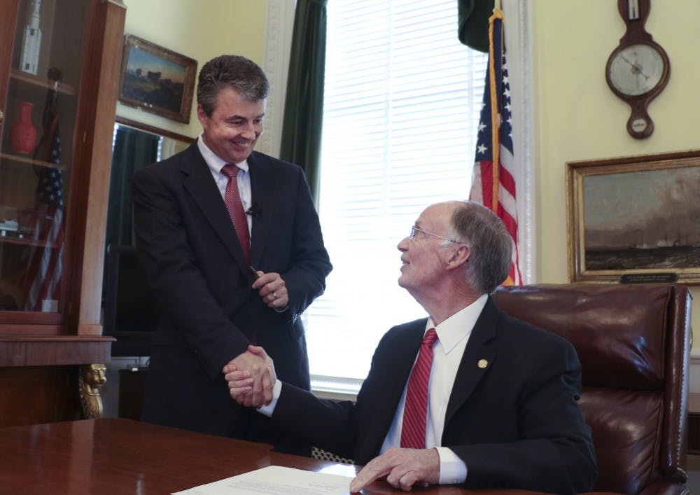 <p>Gov. Robert Bentley shakes hands with new Alabama Attorney General Steve Marshall, after signing his appointment letter at the state Capitol in Montgomery, Friday, Feb. 10, 2017. Marshall has served as the district attorney in Marshall County in north Alabama, appointed to the post in 2001 and re-elected three times. He is a past president of the Alabama District Attorney's Association and currently serves as commission chairman of the Alabama Criminal Justice Information Center.(Governor's Office, Jamie Martin) </p>