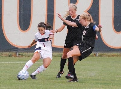 Ana Cate, junior midfielder, quickly changes direction of the ball against Vanderbilt at home Friday evening. (Maria Iampietro / PHOTO EDITOR)