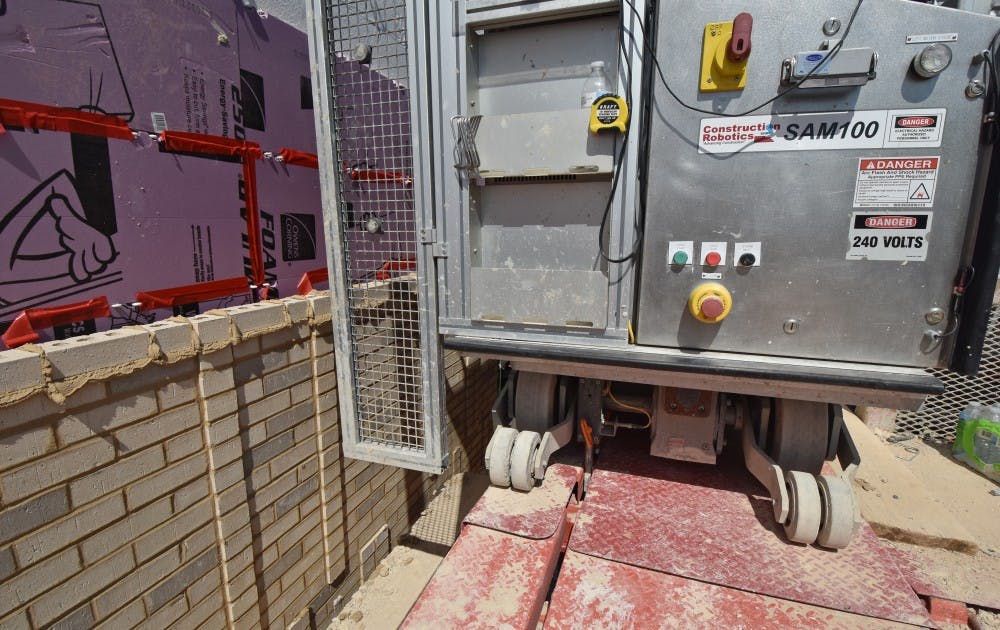 Construction Robotics SAM100 laying bricks at the Jay and Susie Gogue Performing Arts Center in Auburn, Ala.&nbsp;
